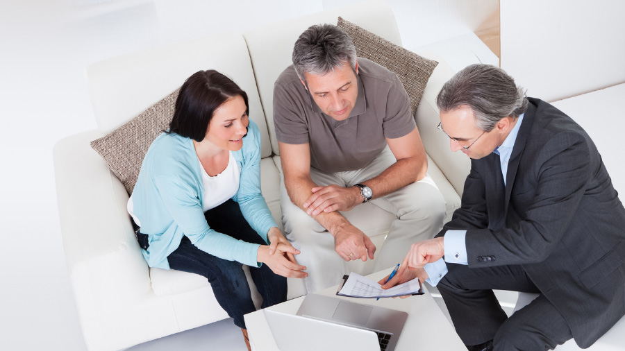 Timeshare owners meeting with a Seaside Consultants Group representative for Sunterra Resorts timeshare cancellation services.